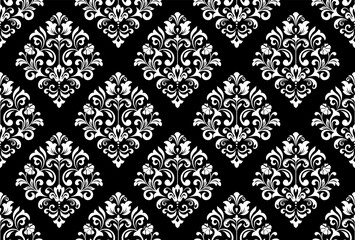 Wallpaper in the style of Baroque. Seamless vector background. White and black floral ornament. Graphic pattern for fabric, wallpaper, packaging. Ornate Damask flower ornament