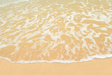 Wave of the sea on the sand beach