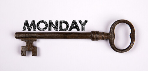 MONDAY Concept. Text and key to success on a white background