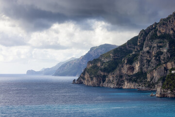 Fototapeta na wymiar Rocky Cliffs and Mountain Landscape by the Tyrrhenian Sea. Amalfi Coast, Italy. Nature Background.