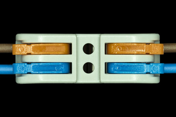 Fototapeta premium Compact splicing connector isolated on black background.