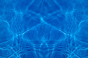Defocus blurred transparent blue colored clear calm water surface texture with splashes and bubbles. Trendy abstract nature background. Water waves in sunlight with copy space. Blue watercolor shining