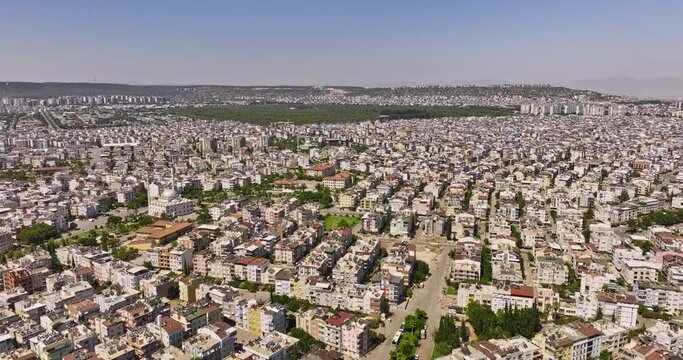 Antalya Turkey Aerial v40 establishing drone flyover across yesilyurt and ahatli kepez neighborhoods capturing local street and residential housing area in daytime - Shot with Mavic 3 Cine - July 2022