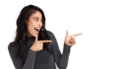 PNG Shot of a beautiful young woman pointing at copy space against a grey background