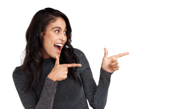 PNG Shot of a beautiful young woman pointing at copy space against a grey background