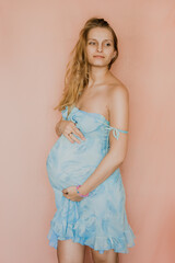 pregnant woman in blue dress