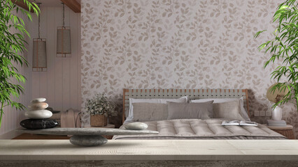 Wooden vintage table or shelf with stone balance, over japandi bedroom with bed and wallpaper, feng shui, zen concept architecture interior design