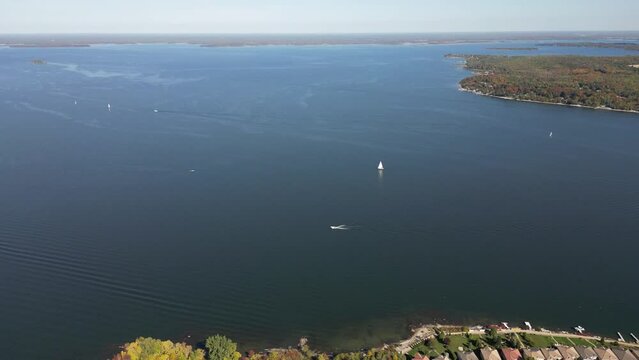 Lake simcoe drone view paying into sail boat