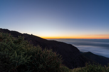 Sunset with sea of clouds and astronomical observatory