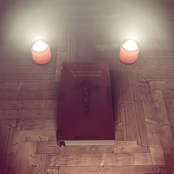 exorcism book on wooden floor