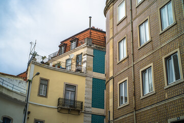 historic buildings of the old town of lisbon. Old colorful buildings, narrow streets, historic churches. Cloudy day