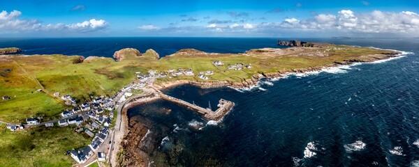 Aerial view of the settlement An Baile Thiar or West Town on Tory Island and harbour, County...