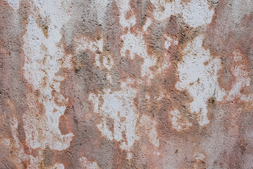 Old concrete wall distressed and peeling paint grunge background and wallpaper texture