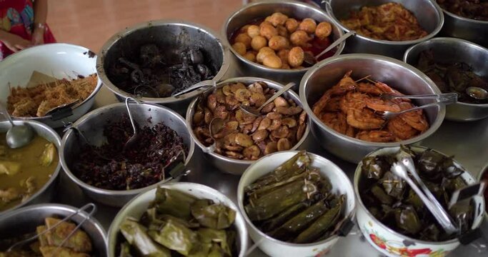 Jamblang Rice or Sega Jamblang or Nasi Jamblang. Traditional rice dish from Cirebon, West Java. Steamed rice wrapped in fragrant teak leaf and served with plenty of side dishes.
