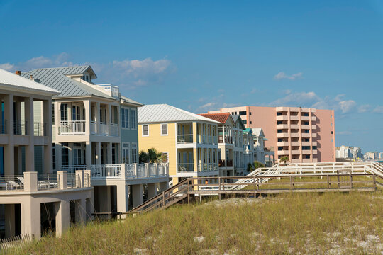 Destin, Florida- Row of beach houses and hotel with footbridges over the sand dunes
