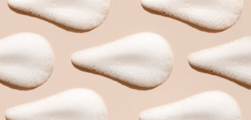 texture foam mousse foam cosmetic smear sample on beige background