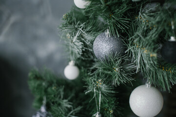 Fototapeta na wymiar Christmas balls hanging on the Christmas tree