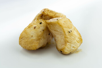 fresh baked chicken cubes on white background