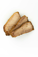 fresh baked pork slices isolated on a white background