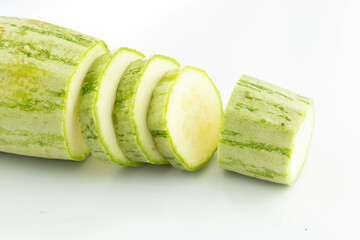 sliced fresh green cucumber isolated on a white background