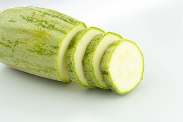 sliced fresh green cucumber isolated on a white background