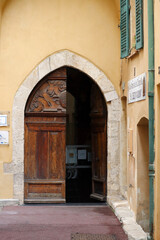 Fototapeta na wymiar The side door to the Saint-Bernardin Chapel is in solid walnut and dates from March 20, 1581.