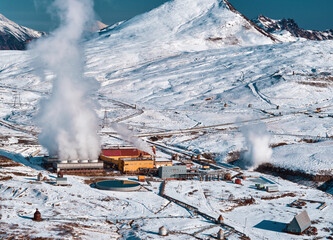 Aerial view to geothermal power plant in mountain. Clean renewable green energy in Kamchatka. - 550571886