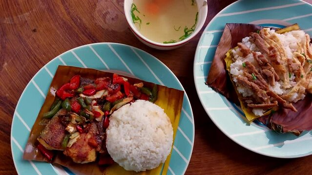 Dolly push to a table full of authentic traditional khmer food for breakfast of Trei boeng kanh chhet and Bai sach chrouk