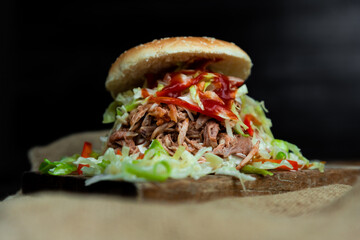 Pulled pork sandwich with coleslaw, buns and seasoning. Pulled pork burgers