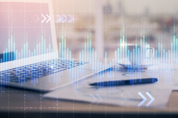 Forex graph hologram on table with computer background. Double exposure. Concept of financial markets.