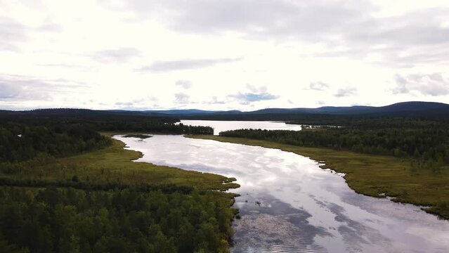 Overcasted skies lurking over Abisko National park shores Sweden aerial 