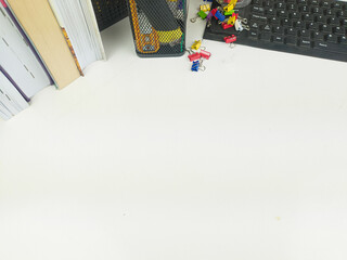 Flat lay, white desk in the office with layout space.with office equipment such as pencils, notebooks and keyboards at the top.mock up table