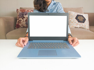 mockup laptop. asian woman showing new model laptop to recommend buying advice in casual jean jacket on white table