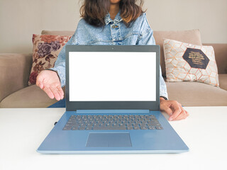 mockup laptop. asian woman showing new model laptop to recommend buying advice in casual jean jacket on white table