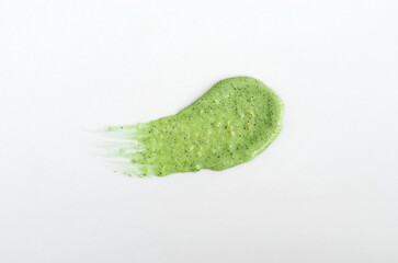 Green clay (avocado, cucumber, matcha tea, algae) face or body exfoliating scrub texture. Beauty...