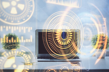 Fototapeta premium Computer on desktop in office with technology theme hologram. Double exposure. Tech concept.