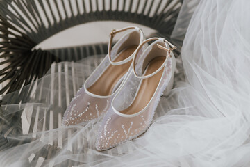 Beautiful detail close up white woman wedding shoes.