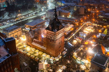 Beautifully lit Christmas fair in the Main City of Gdansk at dusk. Poland
