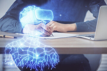 Fototapeta premium Abstract man wearing augmented reality headsets computer work with writing human background. AR concept. Double exposure.