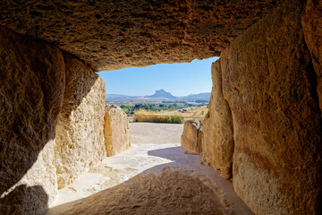 Interior of the megalithic monument Dolmens in Antequera with the natural monument The Lovers' Rock...