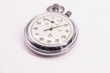 Old antiquary timer clock on the white background