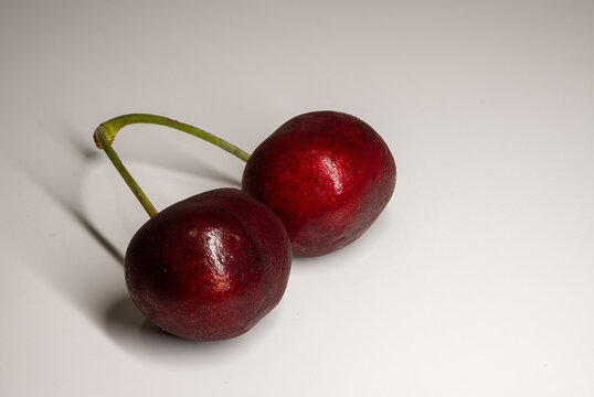two cherries in white background