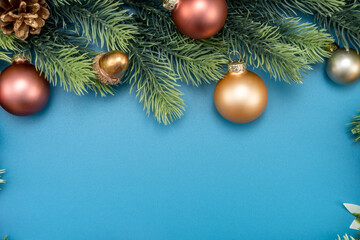 Christmas composition. festive decor on blue background. Copy space, flat lay, top view.