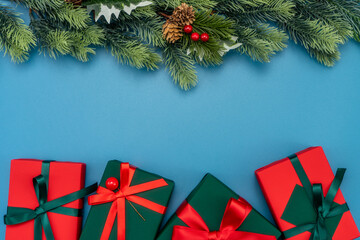 Christmas composition. festive decor on blue background. Copy space, flat lay, top view.