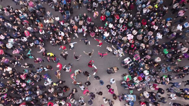 People Dancing Chacarera Folk Popular Dance During Feria De Mataderos In Buenos Aires City, Argentina. Aerial Top-down Orbiting Directly Above