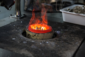 The remains of gold after stamping are melted again in a refractory glass to a liquid state for further casting of other products.