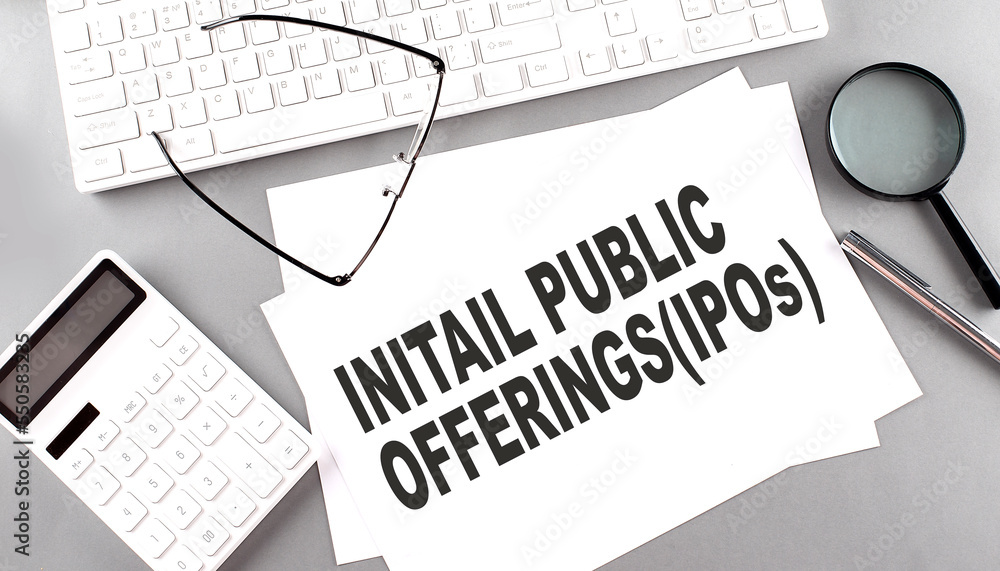 Poster initial public offering text on paper with keyboard, calculator on grey background