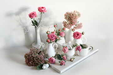 still life with roses and white dishes