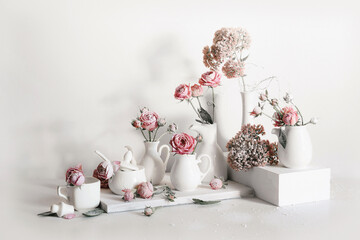 still life with roses and white dishes