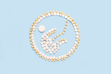 Infant, a child in a fetal position, an embryo made of pills. The concept of pregnancy, artificial insemination, medical examination, technology